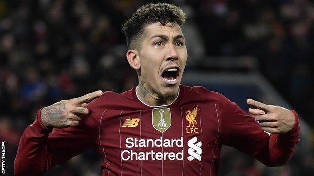 Roberto Firmino celebrates his extra-time goal against Atletico