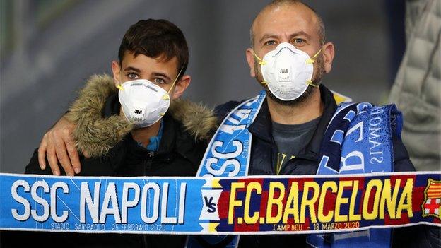 Napoli fans wearing a mask