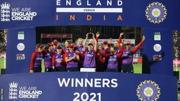 England celebrate with the multi-format series trophy