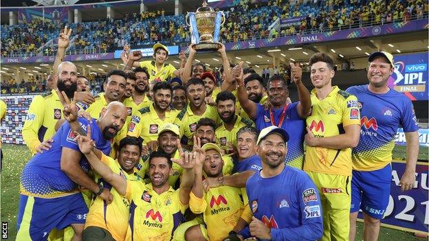 Chennai Super Kings celebrate with trophy after winning 2021 IPL