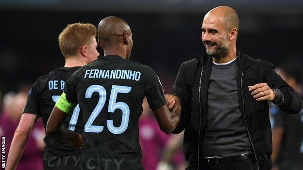 Pep Guardiola celebrates with Fernandinho and Kevin de Bruyne