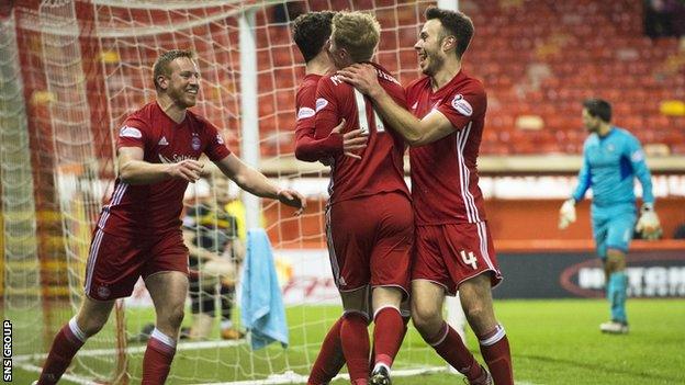 Aberdeen remain eight points behind Celtic after a win over Partick Thistle