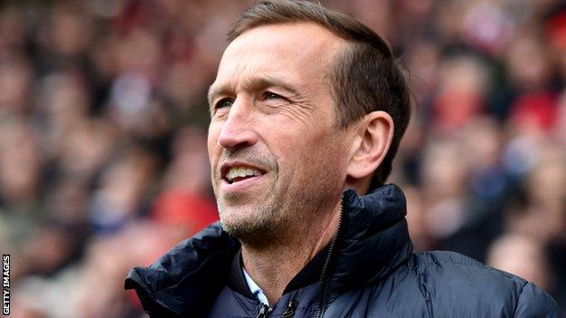 Justin Edinburgh on the sidelines