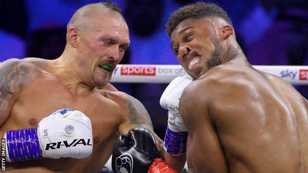 Oleksandr Usyk punches Anthony Joshua