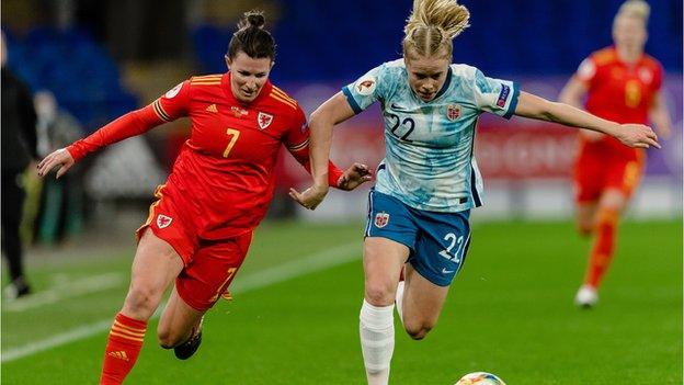 Helen Ward (left) in action for Wales against Norway