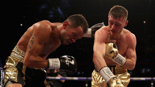 Ryan Burnett punches Yonfrez Parejo during their WBA Bantamweight Championship title fight at Principality Stadium