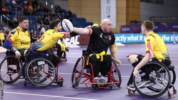 Wales captain Stuart Williams takes on the Scottish defence