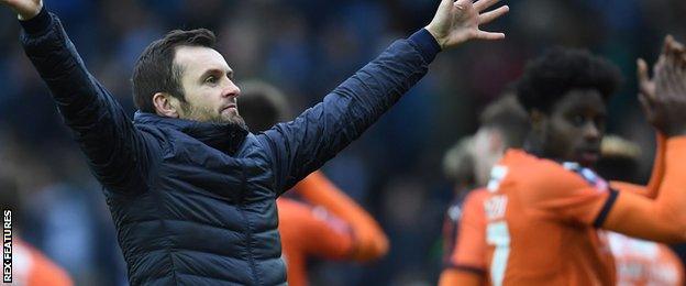 Nathan Jones celebrates with Luton fans