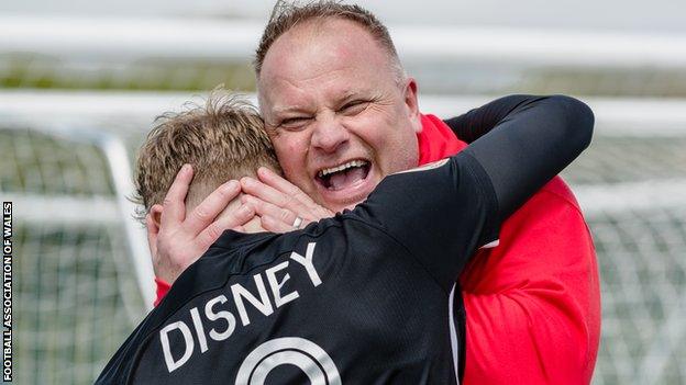 Andy Morrison celebrates with John Disney after Connah's Quay won 2-0 at Penybont to seal their second Cymru Premier title on the final day of last season