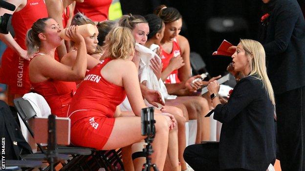 England head coach Jess Thirlby speaks to her team at Commonwealth Games