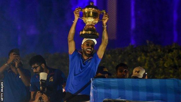 Hardik Pandya and his fellow Mumbai Indians players paraded the IPL trophy on a bus after winning the tournament in 2019