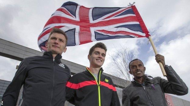 Derek Hawkins, Callum Hawkins and Tsegai Tewelde fly the Union Jack