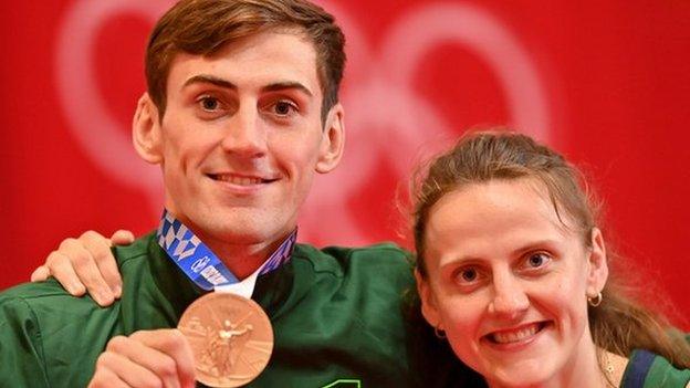 Aidan Walsh won Olympic bronze in the men's welterweight at Tokyo 2020 and his sister Michaela celebrated with him on the podium