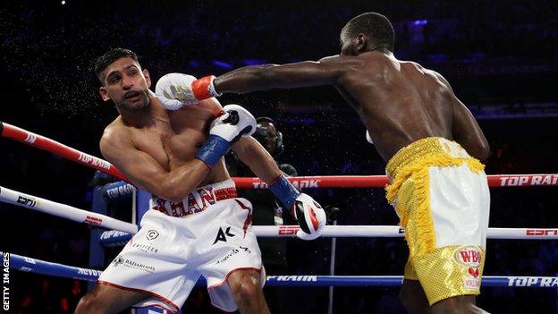 Amir Khan is punched by Terence Crawford