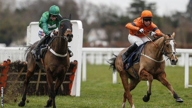 Joe Colliver riding Sam Spinner to victory in the Long Walk Hurdle