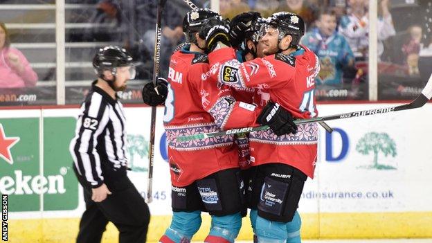 Belfast Giants celebrate scoring one of their two goals against Cardiff Devils