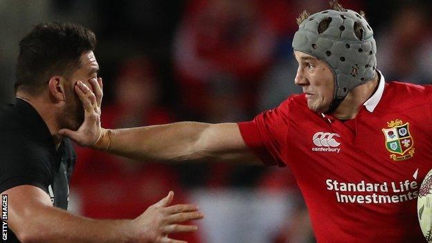 Jonathan Davies hands off Codie Taylor in the first Test