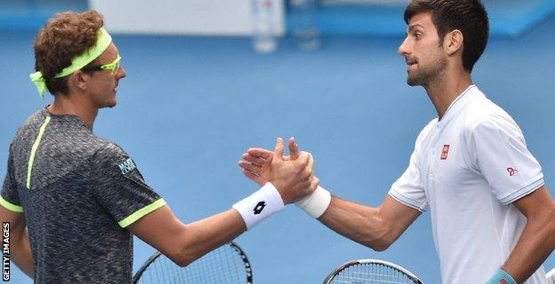 Denis Istomin and Novak Djokovic