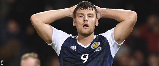 Scotland striker Chris Martin looks dejected at full-time