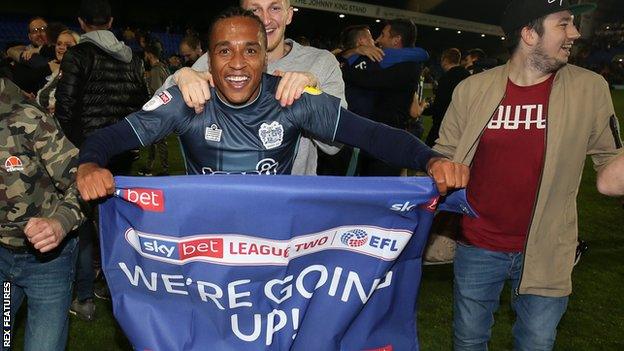 Neil Danns celebrates Bury's promotion to League One