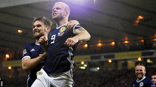 Stephen O'Donnell and Steven Naismith celebrate the latter's goal