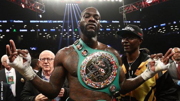 Deontay Wilder celebrates after beating Luis Ortiz in March