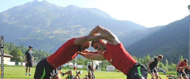 Jamie Roberts and George North grapple during Wales training in the Swiss Alps