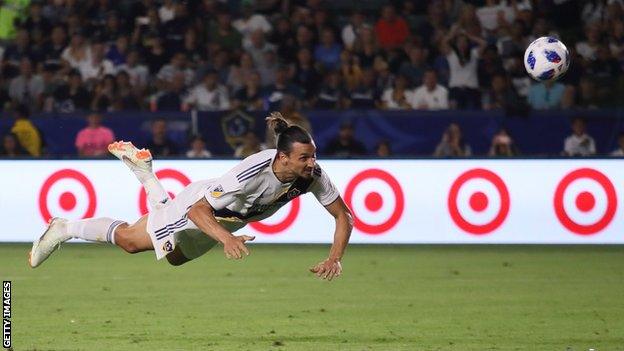 Zlatan Ibrahimovic scores his second goal with a diving header