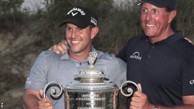 Phil Mickelson and his brother and caddie Tim