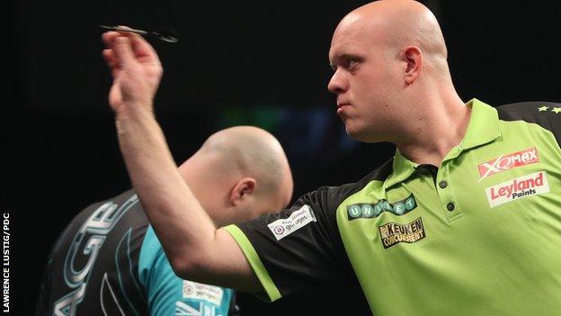 Michael van Gerwen throws a dart