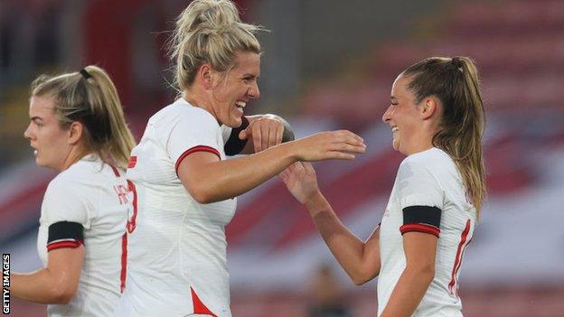 Ella Toone celebrates with Millie Bright