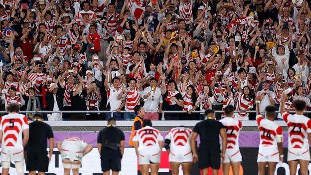 Japan players bow to the crowd