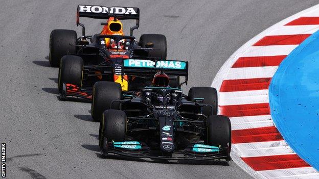 Lewis Hamilton passes Max Verstappen