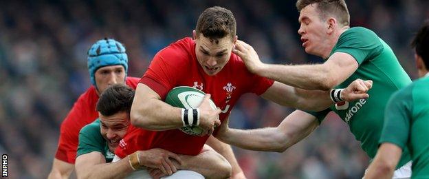 Ireland’s Jacob Stockdale and Chris Farrell with George North of Wales