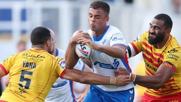 Corey Hall takes on the Catalans defence for Wakefield