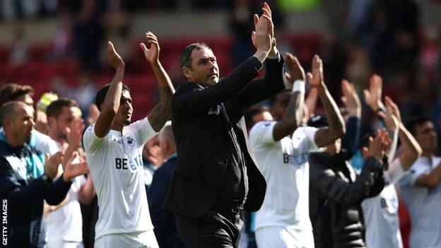 Paul Clement and Swansea's players celebrate the win at Sunderland