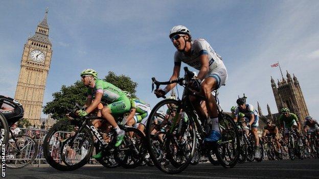 The RideLondon peloton passes the Houses of Parliament during the Prudential RideLondon-Surrey Classic