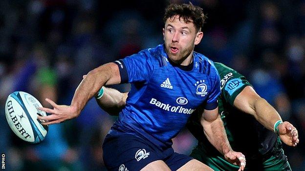 Hugo Keenan produces an offload for Leinster at the RDS