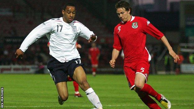 Dexter Blackstock of England U21 battles with Chris Gunter of Wales U21 in May 2008