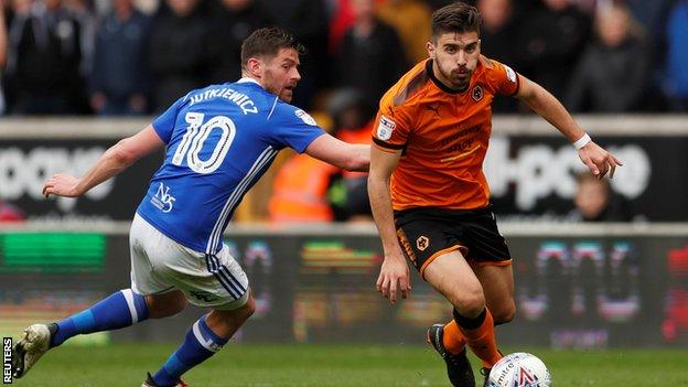 Ruben Neves dribbles the ball past an opponent