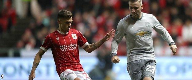 Jamie Paterson lays the ball off for Bristol City against Manchester United