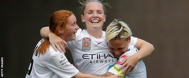 Kim Little (centre) is congratulated by her Seattle Reign team-mates