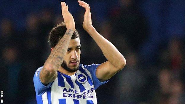 Connor Goldson claps the Brighton fans