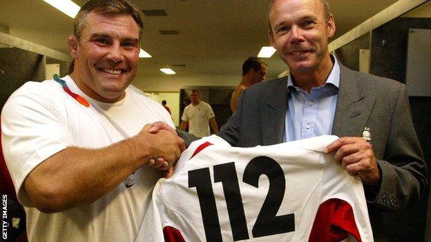 Jason Leonard receives a commemorative shirt from Sir Clive Woodward after winning his 112th England cap