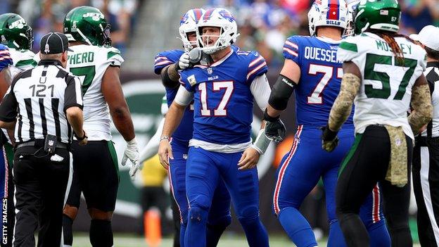 Bills QB Josh Allen argues with players from the New York Jets