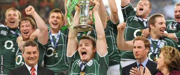 Brian O'Driscoll lifts the Six Nations trophy as Ireland win the Grand Slam