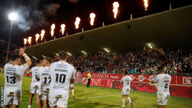 Catalans players celebrate their win over Hull KR