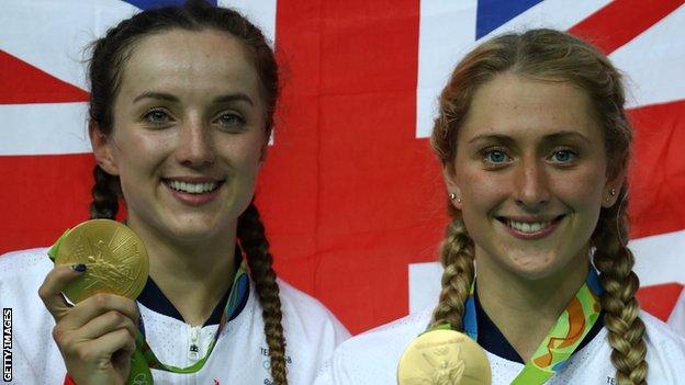 Gold medallists Elinor Barker (L) and Laura Trott (R) celebrate their women's team pursuit success