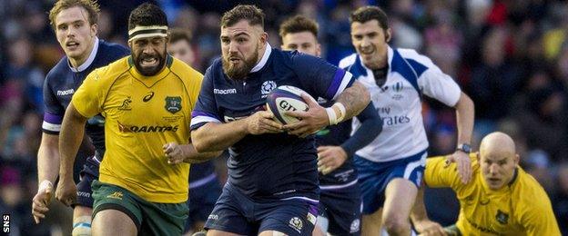 Jamie Bhatti carries the ball for Scotland against Australia