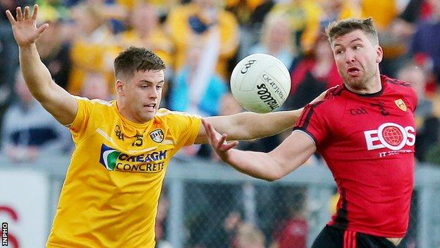 Peter Turley (right) battles with Antrim's Patrick McBride